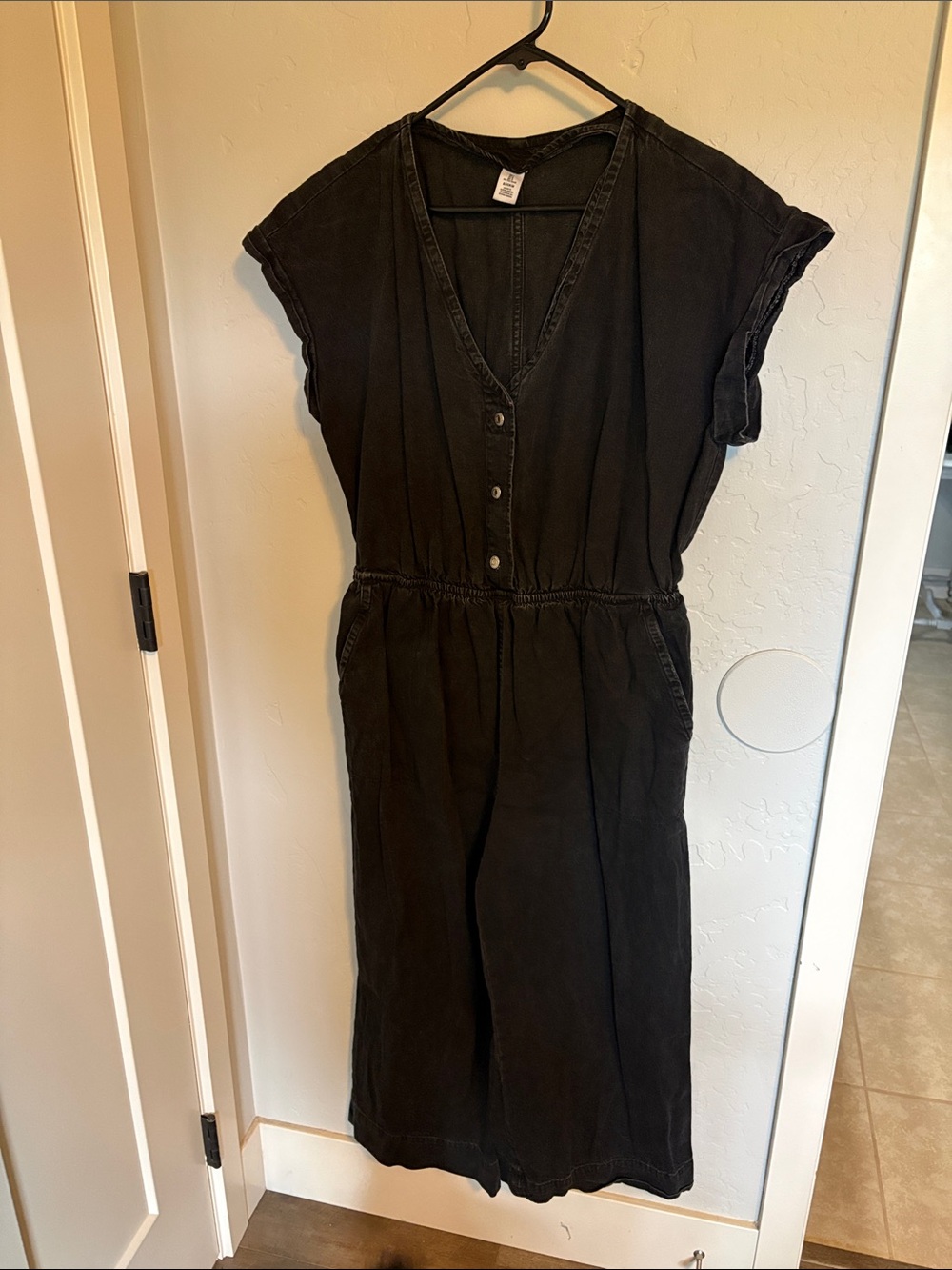 Relaxed Black V‑Neck Button Jumpsuit with Elastic Waist
